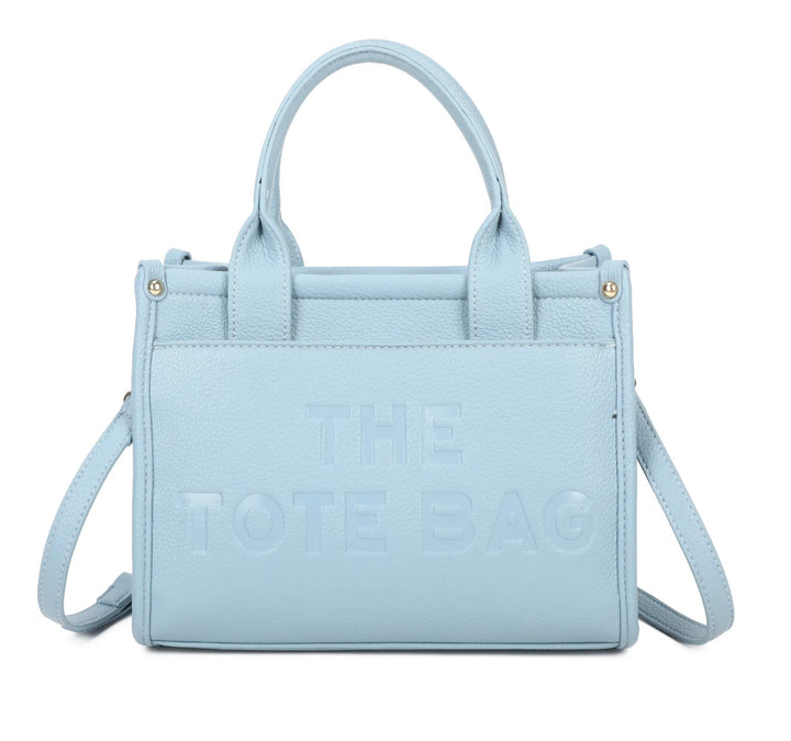 A blue tote bag with the text &