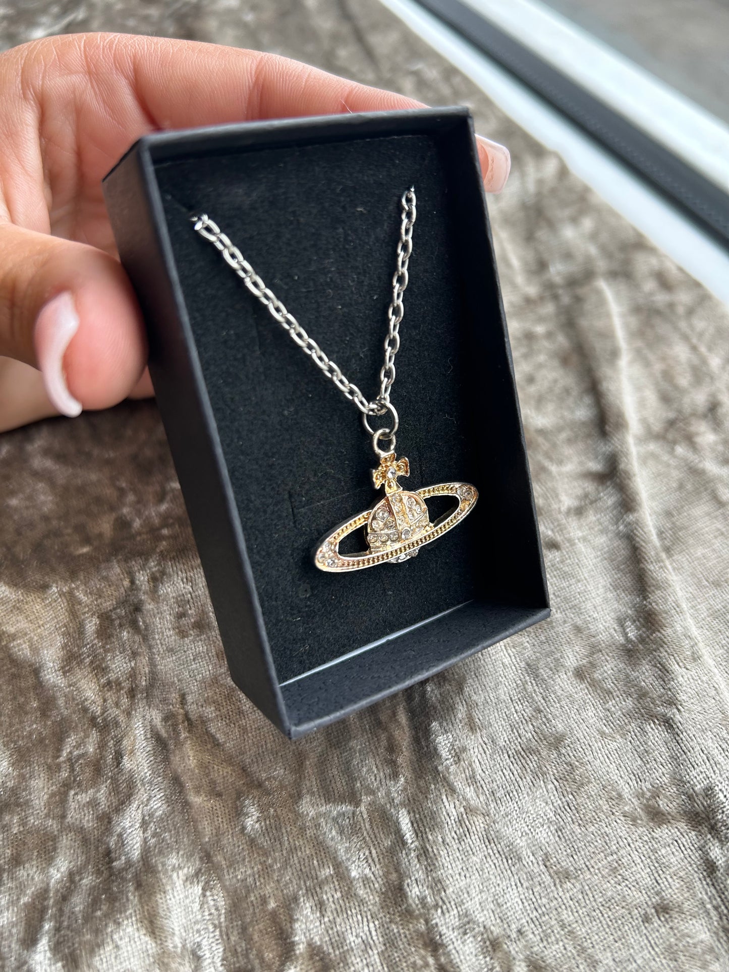 Gold planet necklace