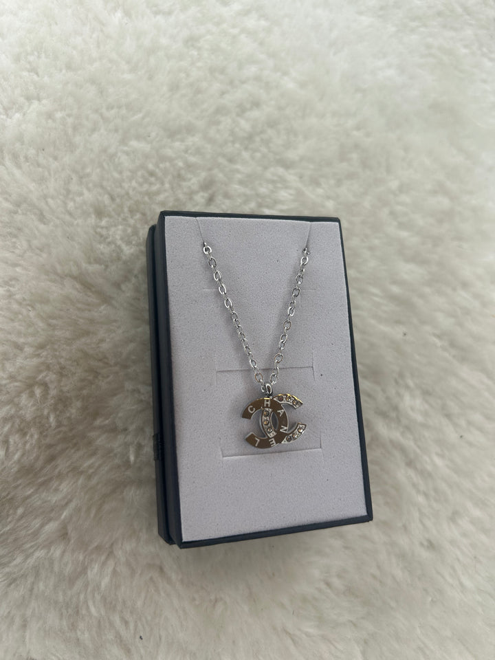 Silver necklace with crystal-embellished pendant 