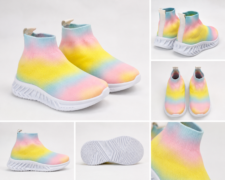 Children’s rainbow slip-on trainers with soft sock-style fit and chunky white grip sole