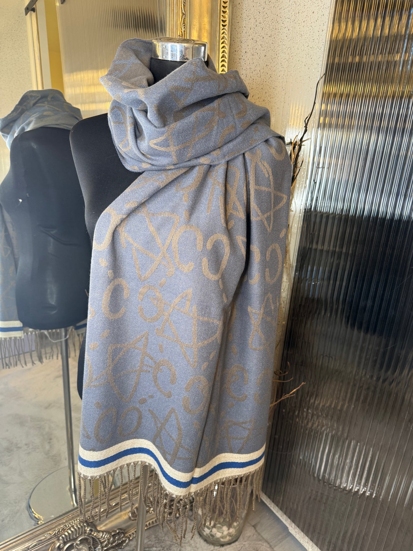 Blue scarf with stripe detail and tassel 