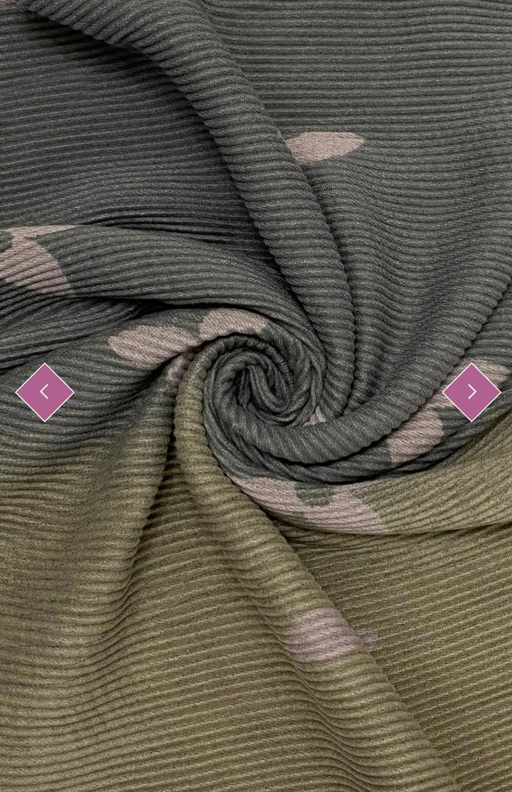 A wool scarf with pleated texture and ombre design, featuring shades of grey and pink flower prints, 