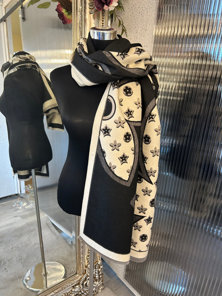 Oversized XL scarf with bold flower print design, displayed as a women’s fashion accessory.