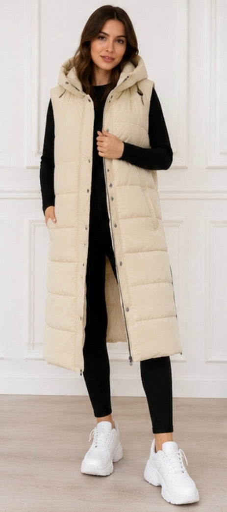 Long cream padded gilet with hood, quilted design and front zip fastening, sleeveless puffer bodywarmer with pockets