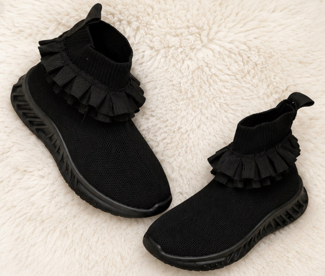 Black kids’ sock-style trainers with layered ruffle ankle detail and chunky black sole