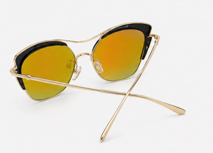 Black and gold cat-eye sunglasses with mirrored orange and green tinted lenses and slim gold arms 