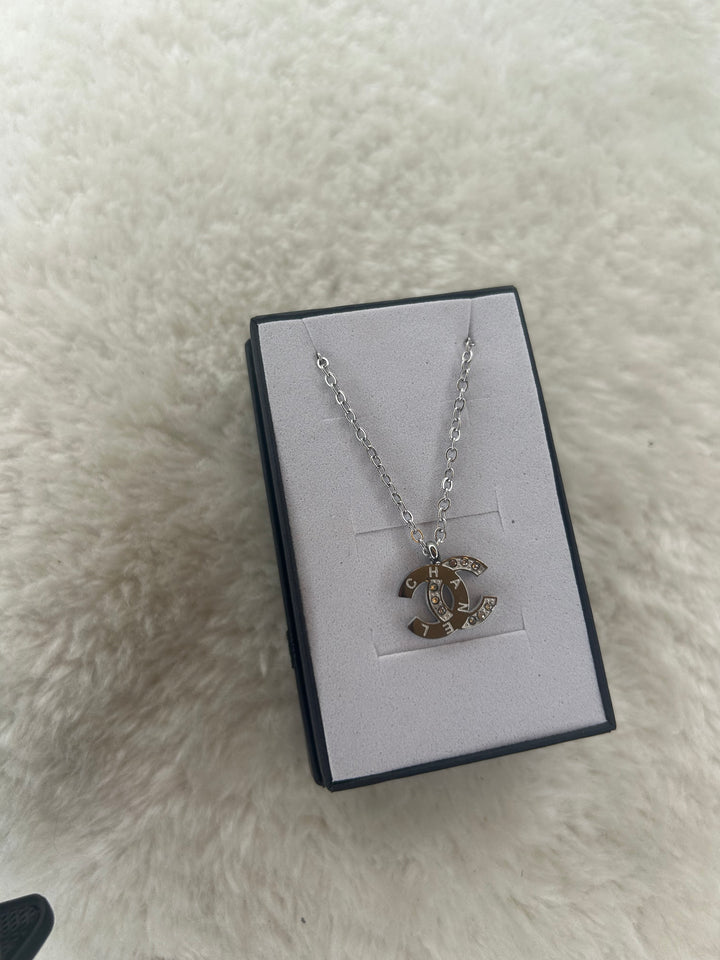 Silver necklace with crystal-embellished pendant 
