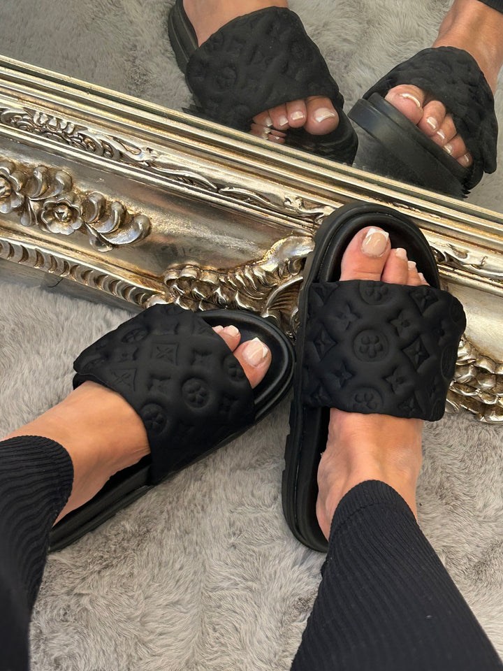 Black textured quilted slider sandals 
