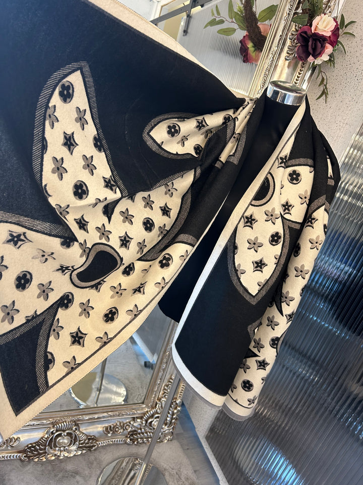 Oversized XL scarf with bold flower print design, displayed as a women’s fashion accessory.