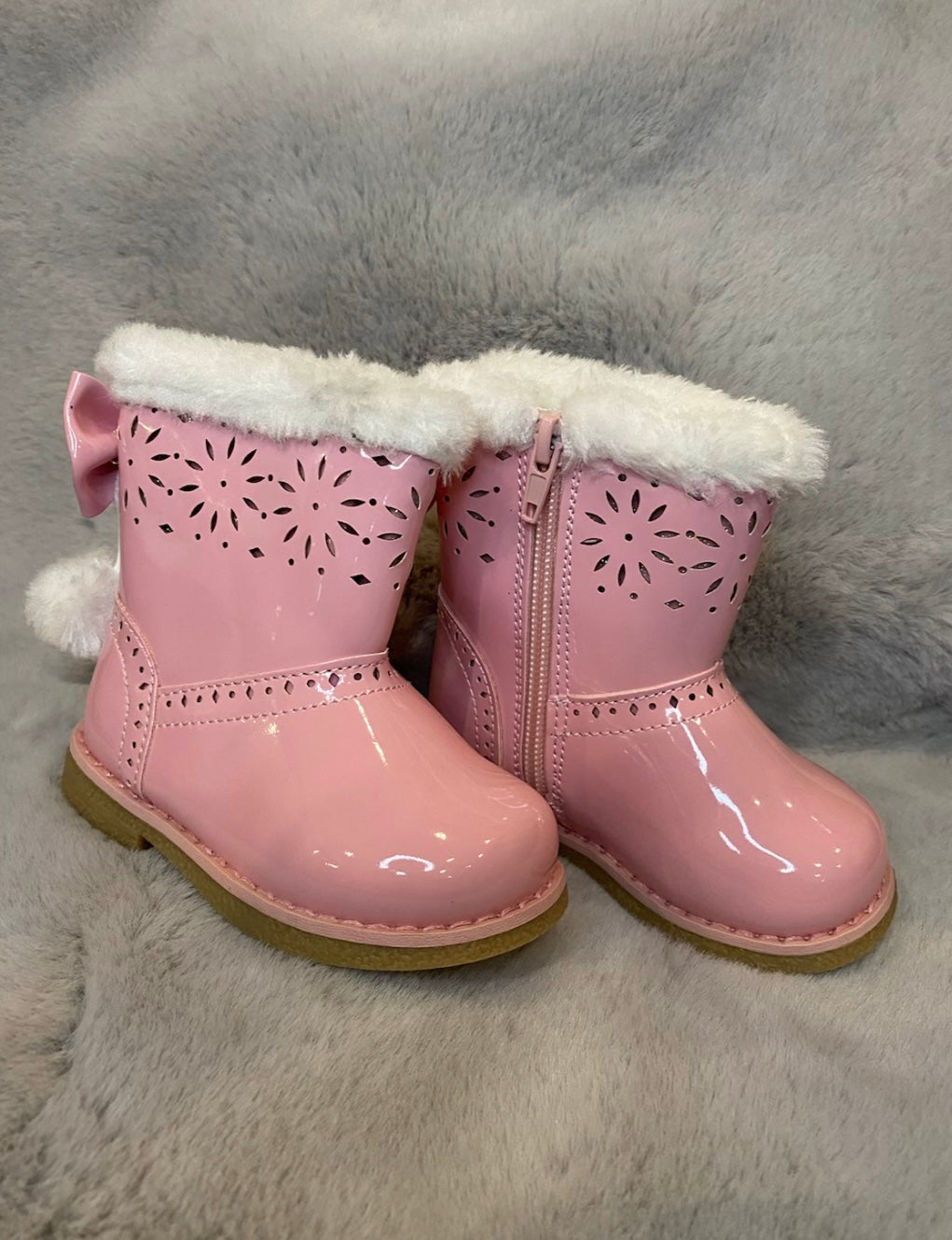 Pink girl boots with bow detail on the back