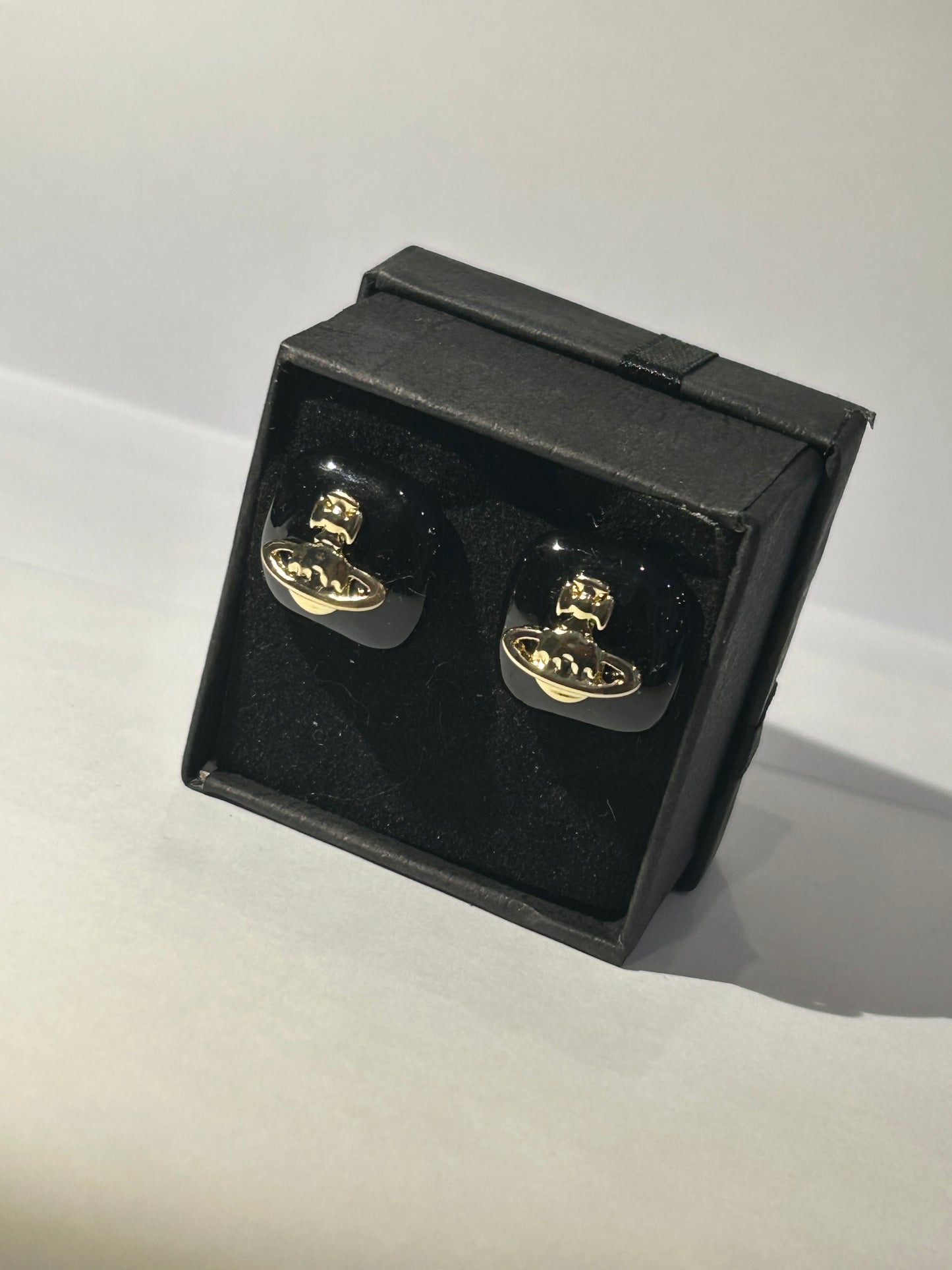 Black square gold detail planet earrings