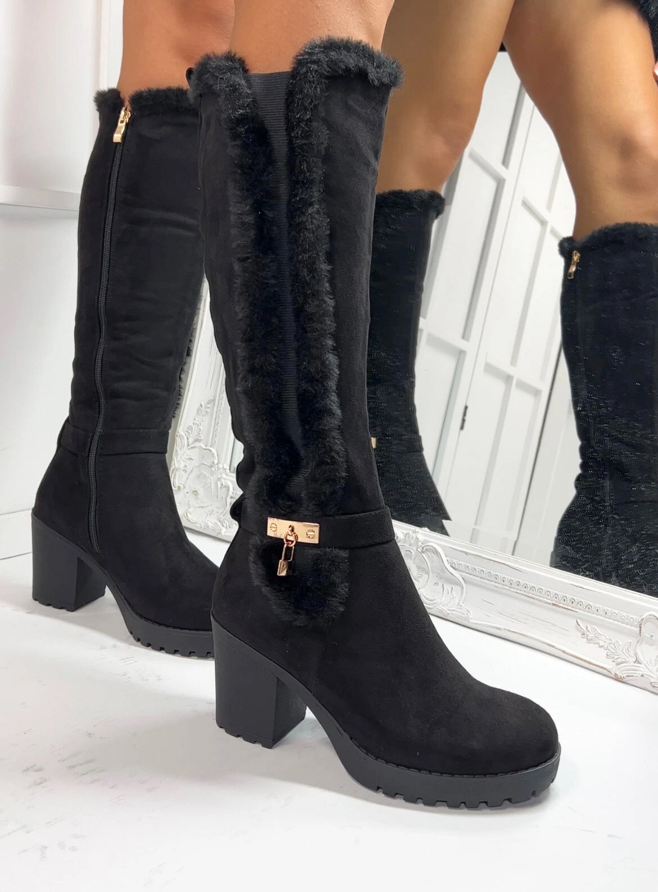 Black fur lined heel knee high boots
