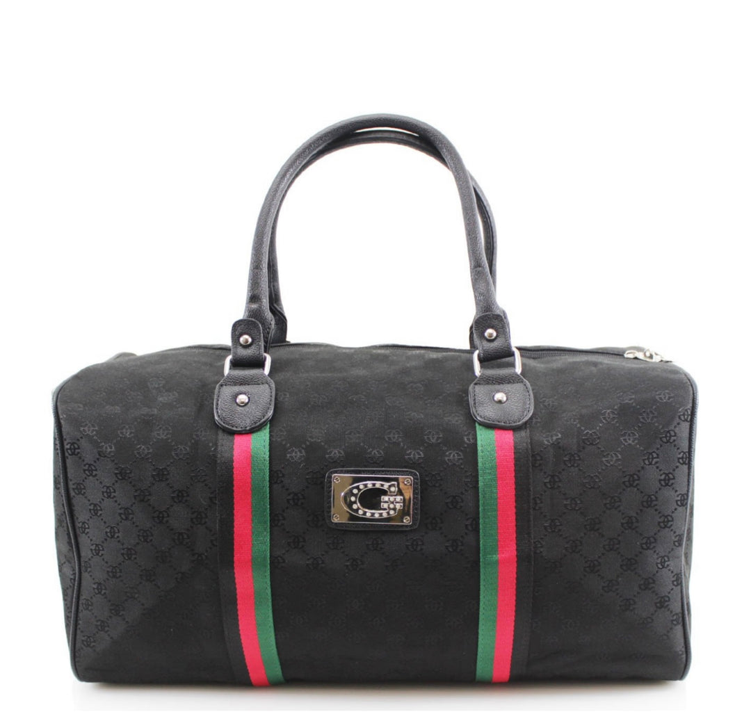 A black holdall luggage bag with a stripe pattern, featuring red and green accents and a brand plaque.