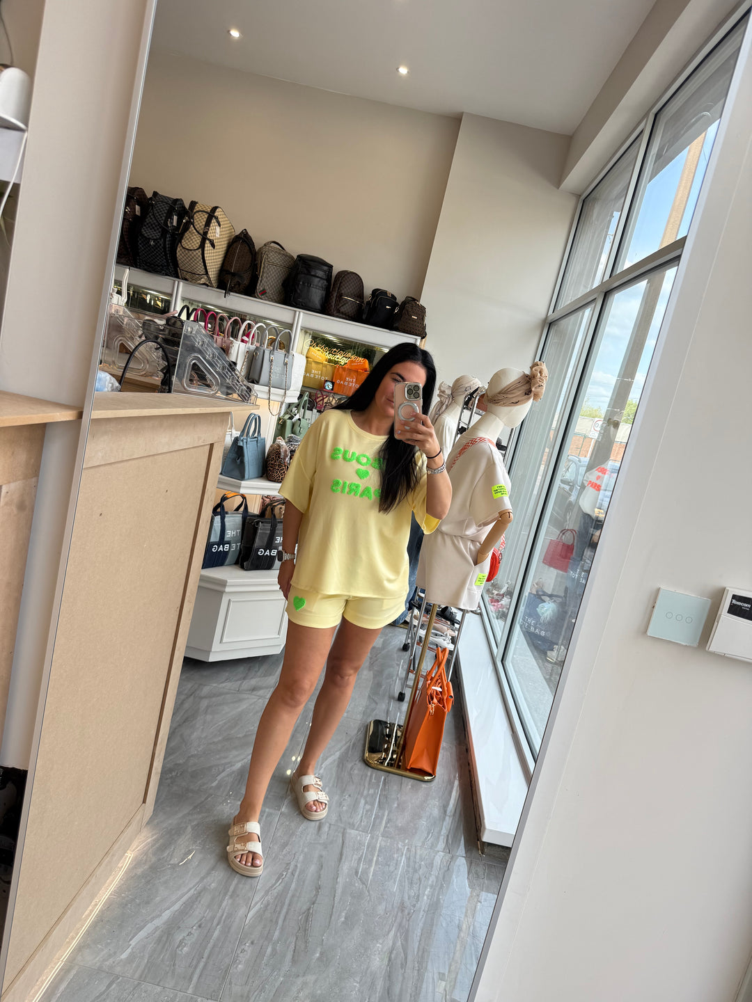 Shorts and T-shirt set in yellow with green writing text 