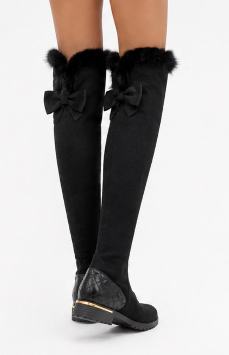 Black over-the-knee boots with faux fur trim and quilted heel detail