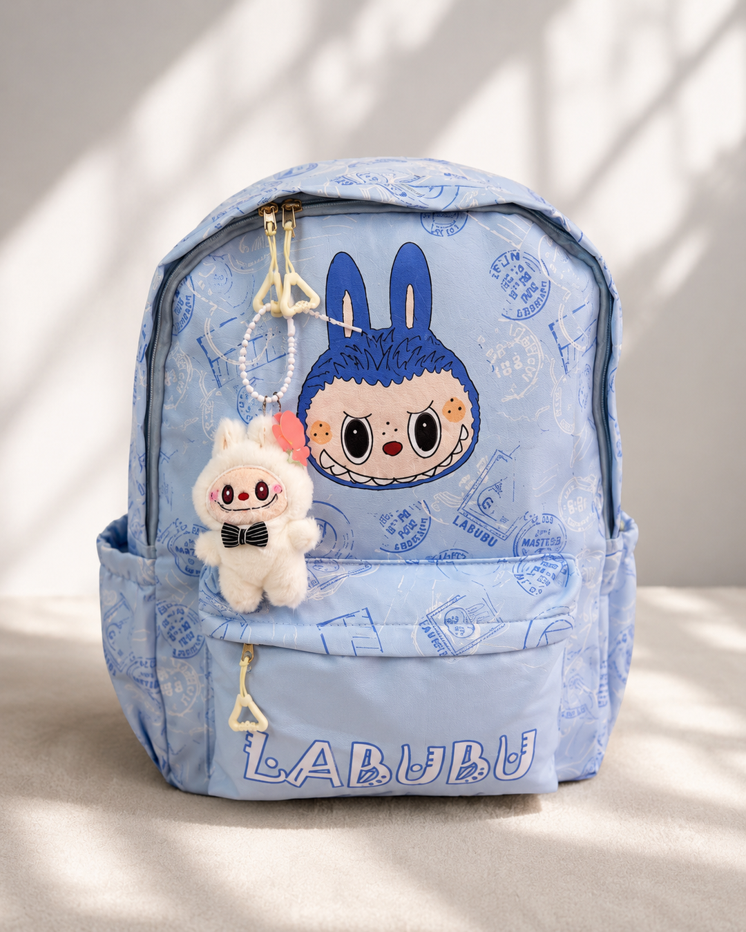     LABUBU backpacks with key ring, front zip pocket and side pockets.