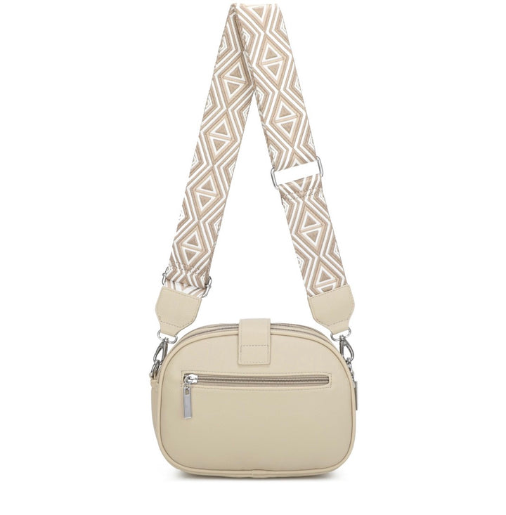 Beige handbag with a patterned strap