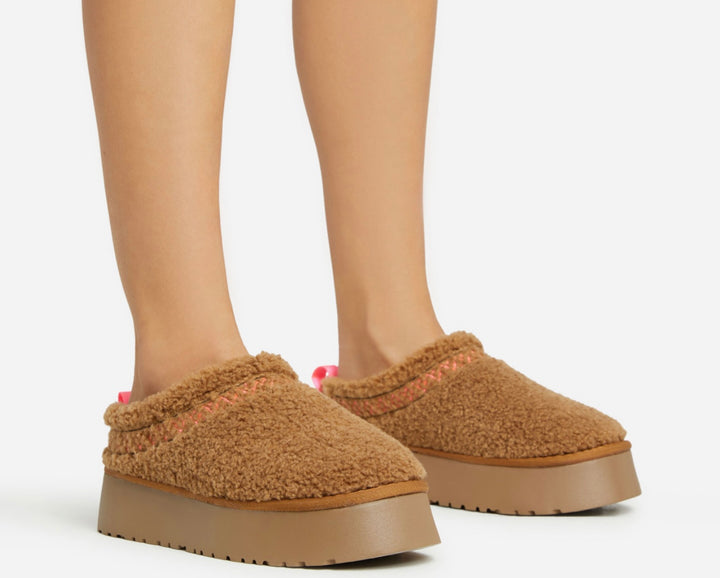 Tan fuzzy outdoor slippers 