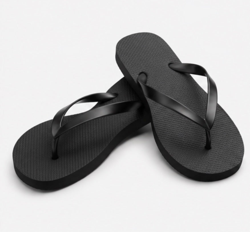 Black flip flops with glossy black straps and textured soles 