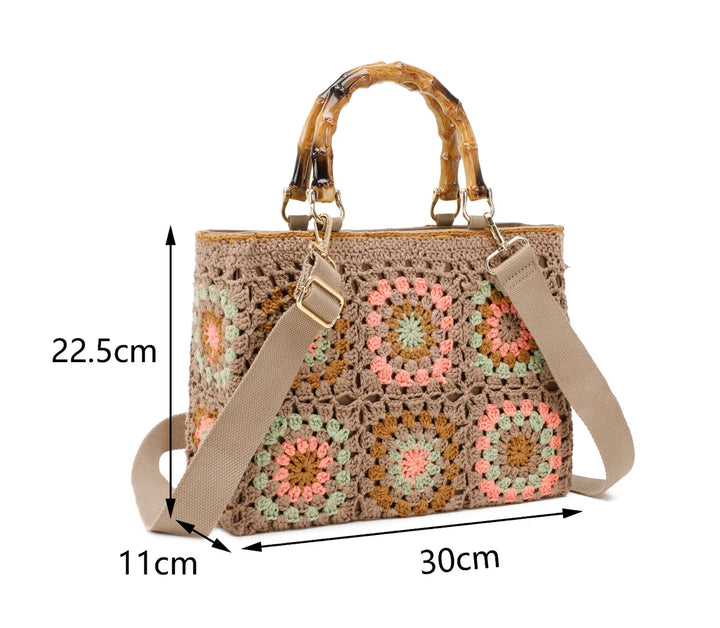 crochet grab bags with bamboo handles and gold tone metal hardware. With adjustable matching strap