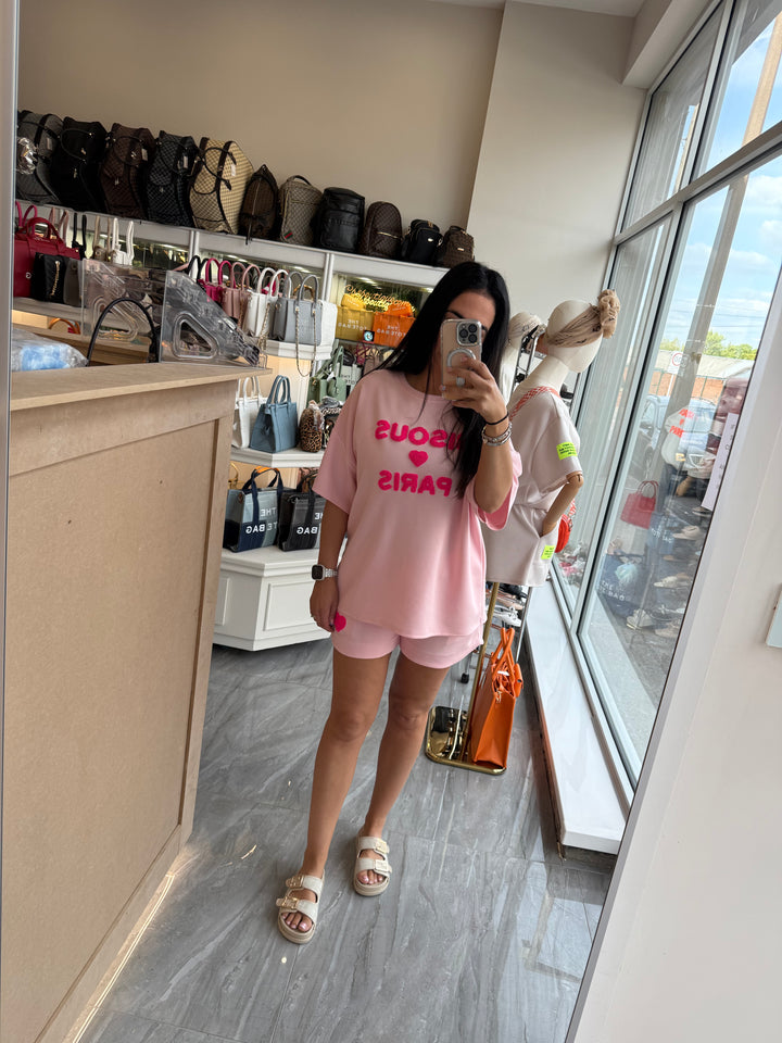 Shorts and T-shirt set in pink with pink writing text 