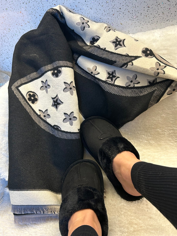 Black slip on slippers with black and cream flower patterned scarf 