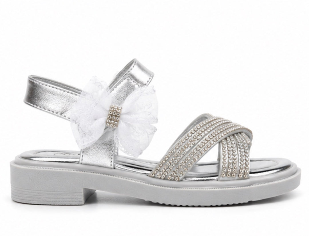 Silver girls’ sandals with sparkling diamanté crossover straps, oversized glitter mesh bow detail 