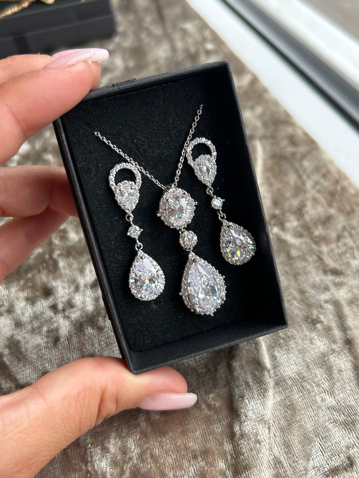 Crystal detail dangle earrings and a necklace with crystal outlines, 