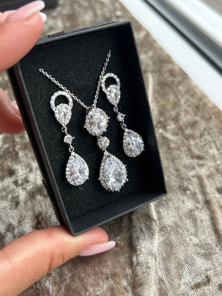 Crystal detail dangle earrings and a necklace with crystal outlines, 