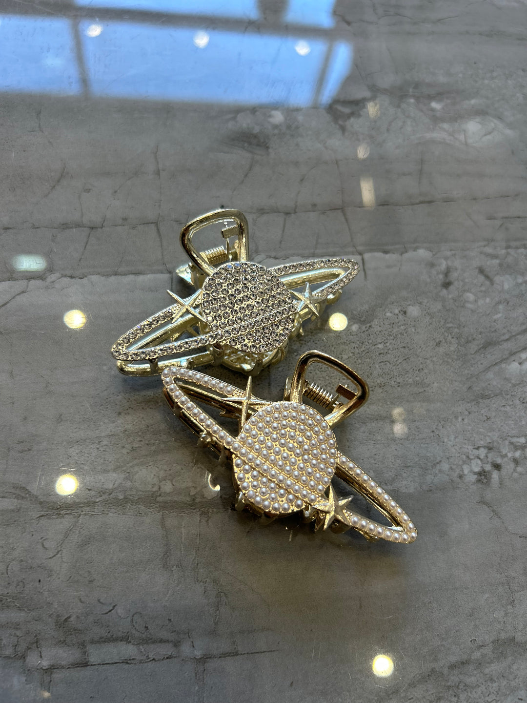 Gold and diamond-encrusted hair clips on 