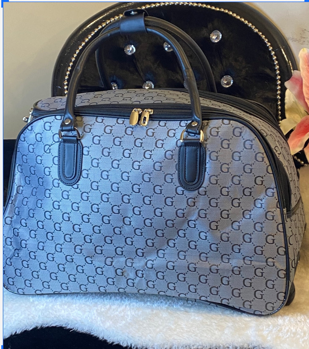 Large Grey holdall with wheels and disguised handle with G letter in black printed across the holdall