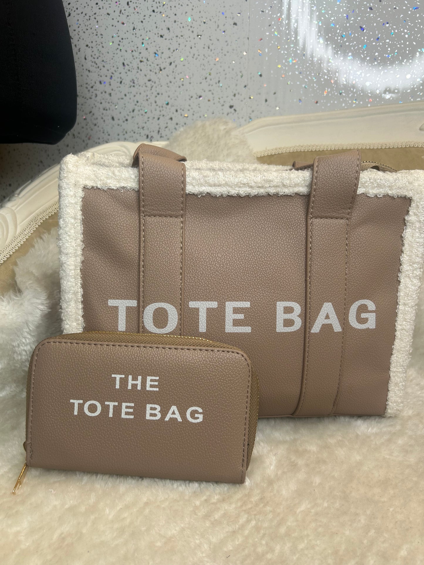 Brown fuzzy tote bags with 'TOTE BAG' text and matching purse 