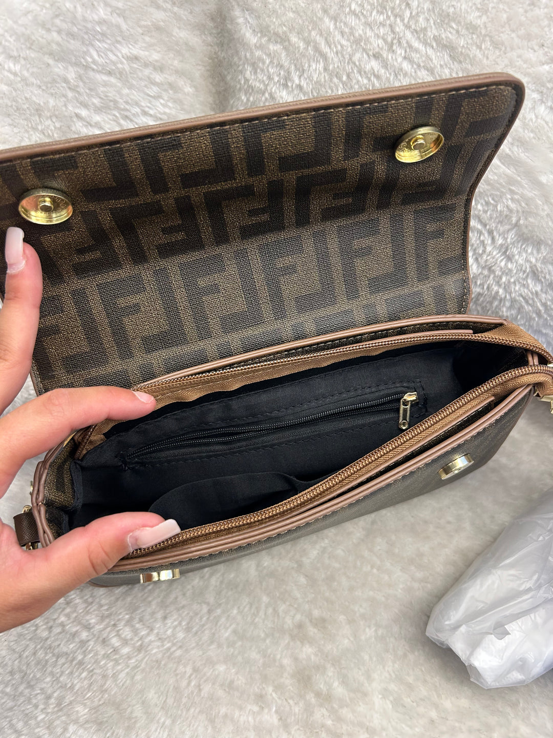 Handbag with a black interior and gold accents