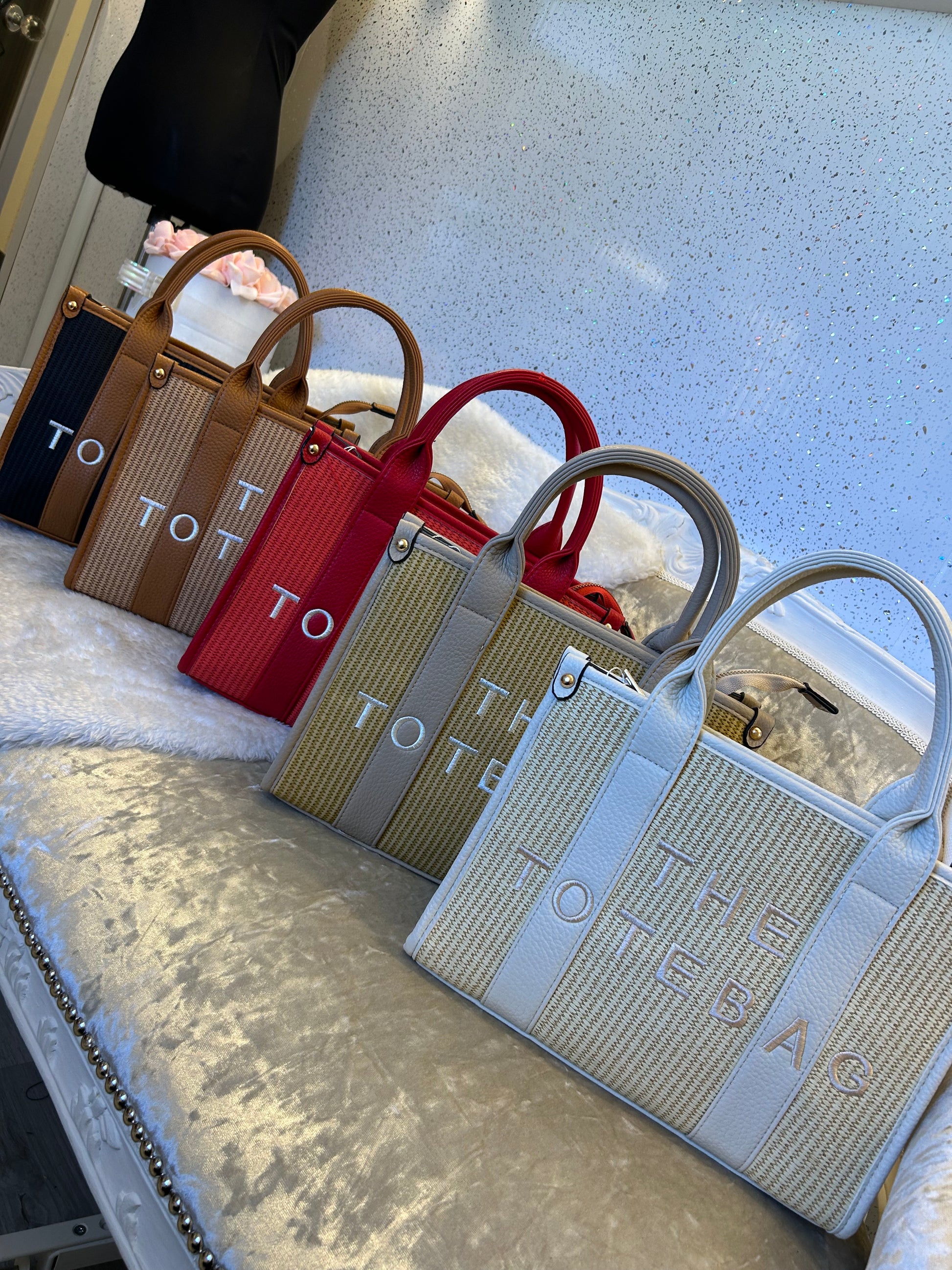 Set of colourful handbags with 'the tote bag” writing 