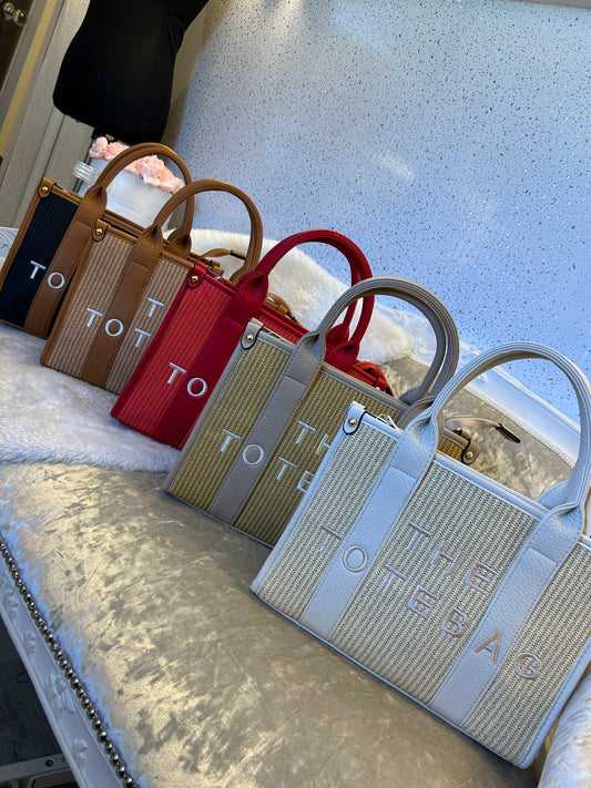 Set of colourful handbags with 'the tote bag” writing 