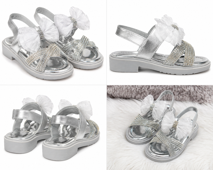 Silver girls’ sandals with sparkling diamanté crossover straps, oversized glitter mesh bow detail 