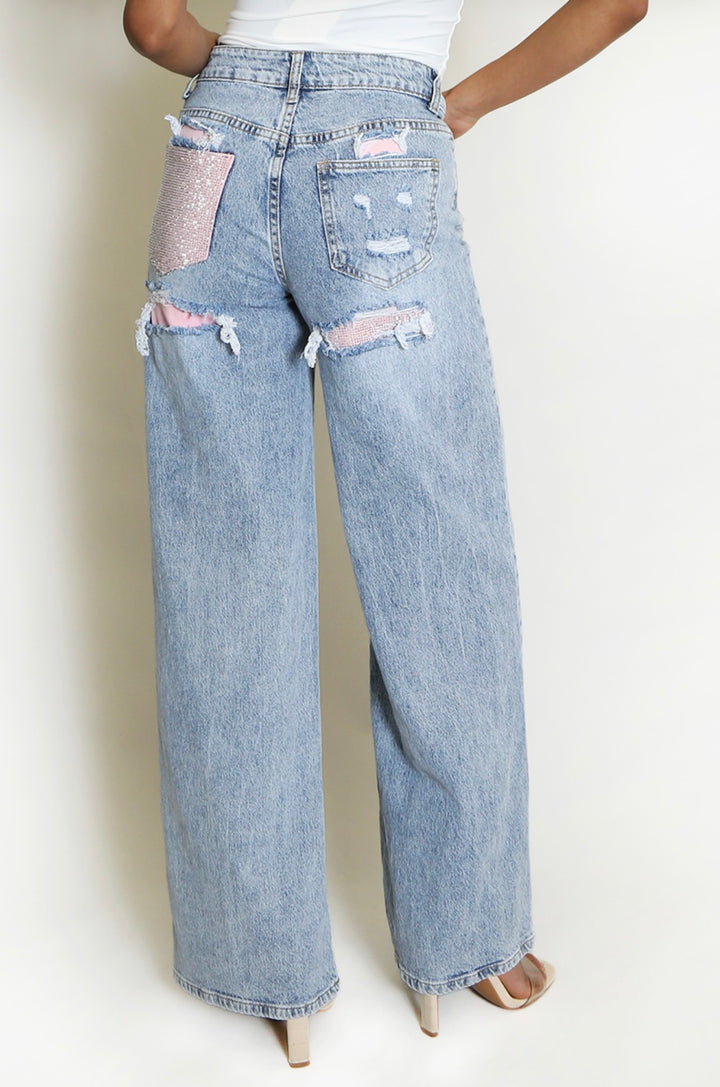 Light blue jeans with distressed details