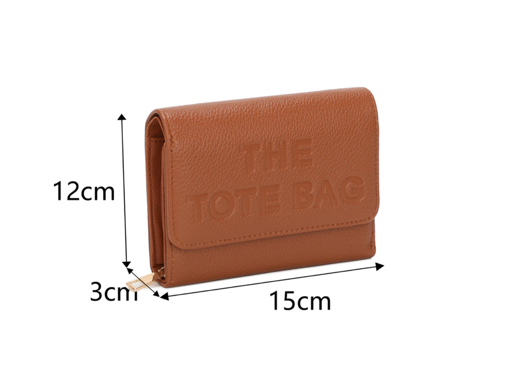 Brown purse with “ The tote bag” detailed and gold zip 