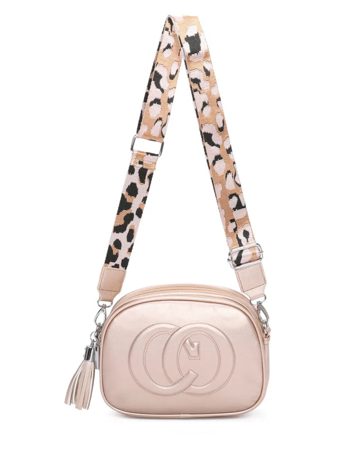 A animal patterned strap cross body bag with a detachable and adjustable strap, featuring multiple zipped compartments and golden tone metal hardware.
