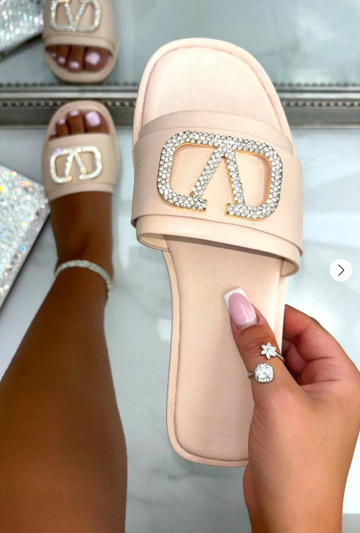 Beige slip-on shoe slider with silver rhinestone embellishment 