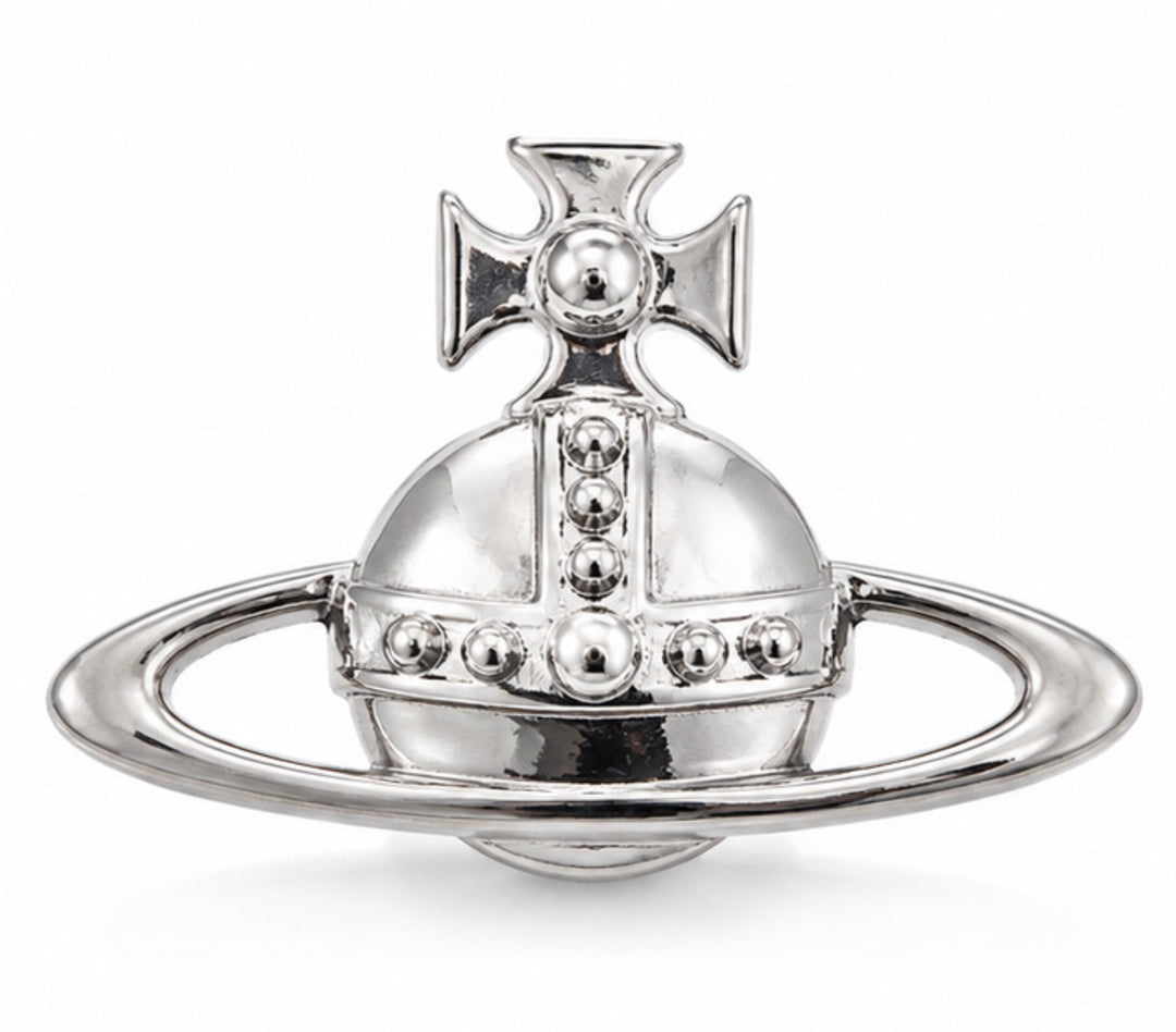 Polished silver-tone statement planet brooch with raised stud detailing and outer ring