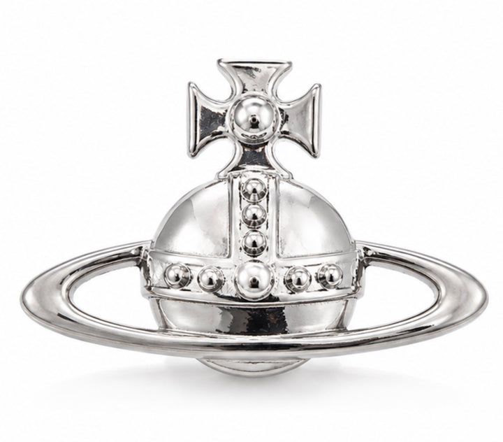 Polished silver-tone statement planet brooch with raised stud detailing and outer ring