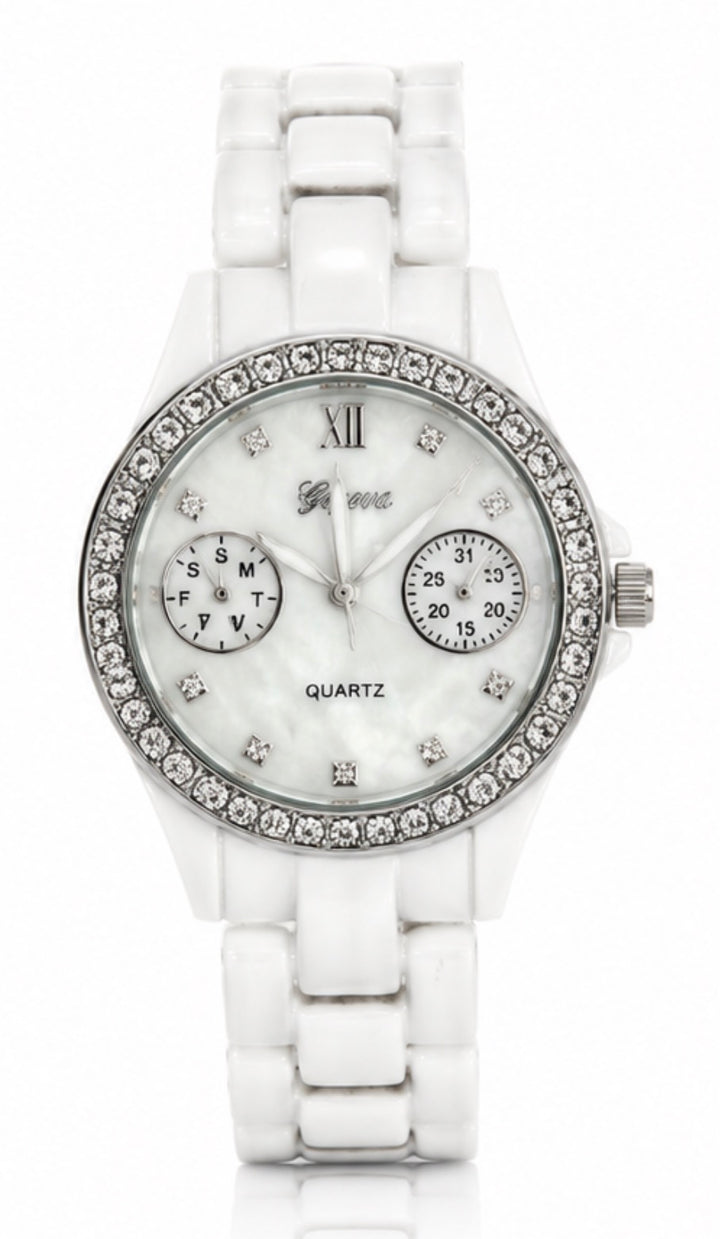 Elegant white bracelet watch with crystal bezel and mother-of-pearl dial displayed on a white background.