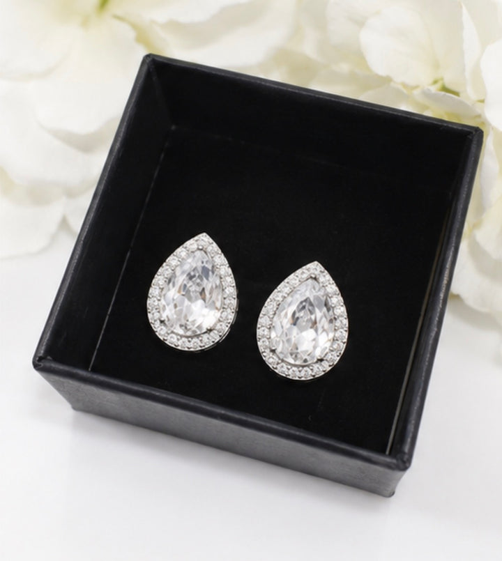 Silver crystal teardrop halo stud earrings with large faceted centre stones and sparkling crystal surrounds.