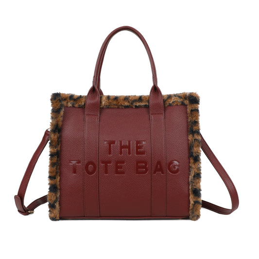 Wine coloured tote bag with animal print fur edging 