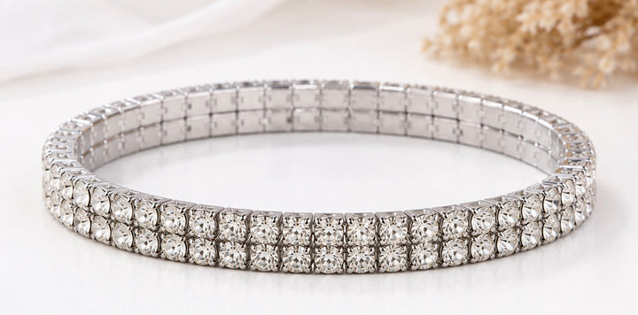 Silver double row crystal stretch bracelet with continuous clear sparkling stones and clasp-free design.