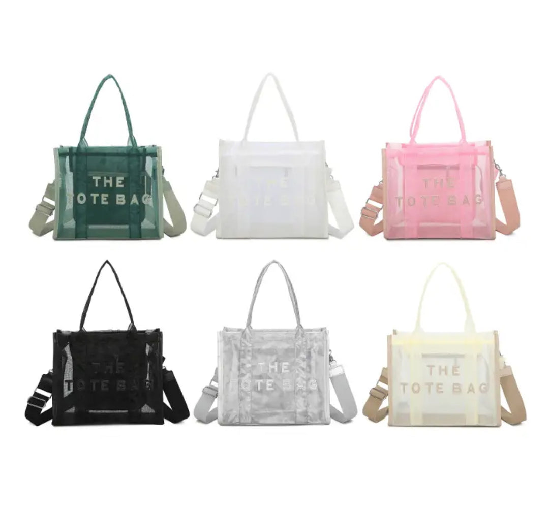 A collection of opaque mesh tote bags in various colours including black, white, pink, green, silver and beige, featuring a top zip closure and an adjustable crossbody strap.