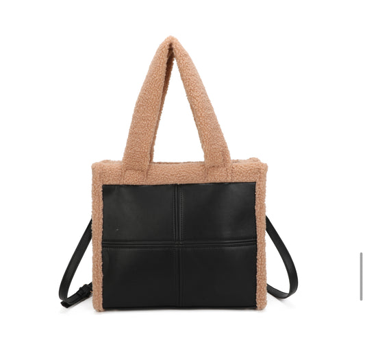 Black tote bag with brown textured fuzzy edging and a detachable adjustable long strap