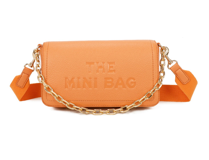 A orange mini tote bag with a chain detail and the text &