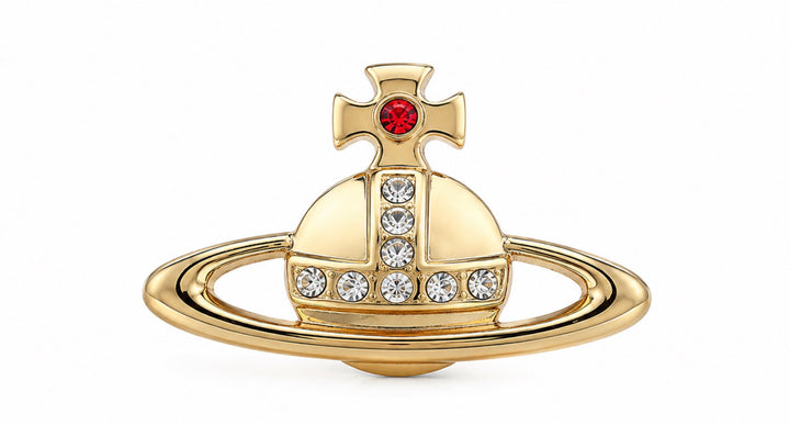 Gold tone orb brooch with clear crystal detailing and red gem